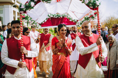 Maharani walking down the aisle with her palms together Maharani walking down the aisle with her palms together