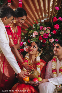 Indian couple receiving the platter with fruit Indian couple receiving the platter with fruit