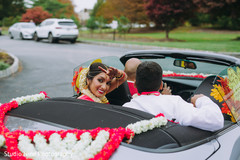 Indian newlyweds leaving in a sporst car Indian newlyweds leaving in a sporst car
