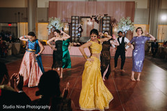 Indian relatives and guests performing a choreography Indian relatives and guests performing a choreography