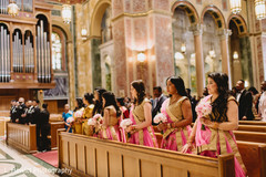 Indian bridesmaids at church on their pink saris. Indian bridesmaids at church on their pink saris.