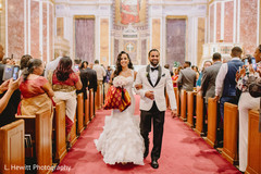 Indian bride and groom walking out down the aisle. Indian bride and groom walking out down the aisle.