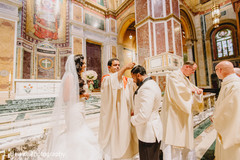 Indian groom being blessed at ceremony. Indian groom being blessed at ceremony.