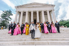 Indian couple walking down the stairs with bridesmaids and groomsmen. Indian couple walking down the stairs with bridesmaids and groomsmen.