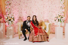 Indian bride and groom posing at wedding reception stage. Indian bride and groom posing at wedding reception stage.