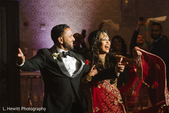 Indian couple making their entrance to wedding reception. Indian couple making their entrance to wedding reception.