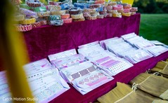 Sangeet favors table with chooras and stickers. Sangeet favors table with chooras and stickers.