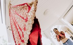 Indian bride admiring her indian wedding ceremony skirt. Indian bride admiring her indian wedding ceremony skirt.