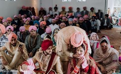 Indian bride's father hugging bride at ceremony. Indian bride's father hugging bride at ceremony.