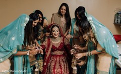 Indian bride getting her Kalire for ceremony on. Indian bride getting her Kalire for ceremony on.