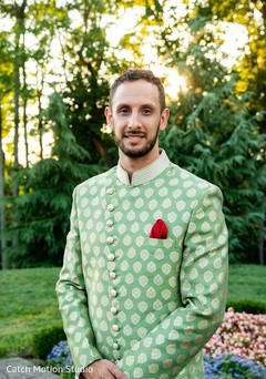 Indian groom posing outdoors on sangeet outfit. Indian groom posing outdoors on sangeet outfit.