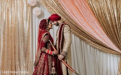 Indian bride and groom on their golden and red ceremony outfits. Indian bride and groom on their golden and red ceremony outfits.