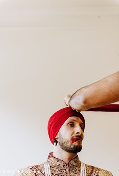 Raja getting his wedding ceremony red pagri on. Raja getting his wedding ceremony red pagri on.