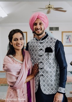 Indian couple on their blue and pink pre-wedding outfits. Indian couple on their blue and pink pre-wedding outfits.