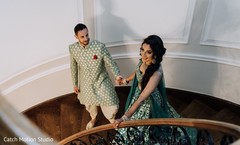 Indian couple walking down the stairs photo session. Indian couple walking down the stairs photo session.