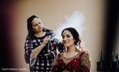 Indian bride getting her ceremony hair style done. Indian bride getting her ceremony hair style done.