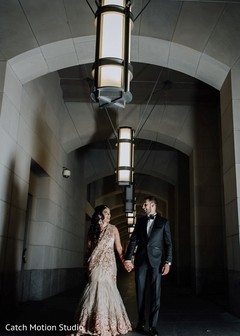 Indian couple posing at wedding venue hall. Indian couple posing at wedding venue hall.