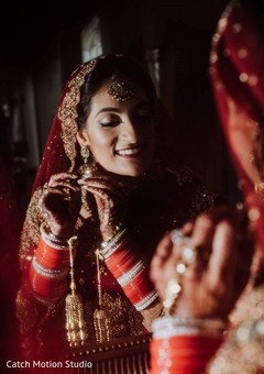 Maharani getting her ceremony earrings on. Maharani getting her ceremony earrings on.