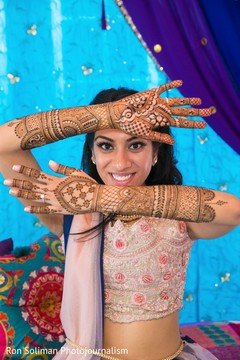 Maharani striking a pose that shows off the mehndi on her arms Maharani striking a pose that shows off the mehndi on her arms