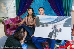 Indian groom showing a picture of him and Maharani Indian groom showing a picture of him and Maharani