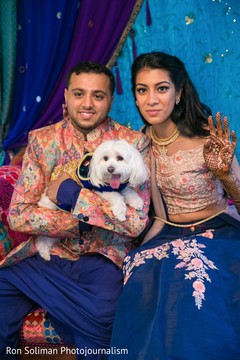 Indian couple posing with a pet dog Indian couple posing with a pet dog