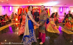 Indian couple holding hands on the dance-floor Indian couple holding hands on the dance-floor