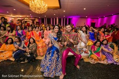 Indian couple posing with their Indian relatives and guests Indian couple posing with their Indian relatives and guests