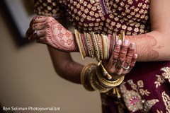 Maharanis golden and red wedding ceremony bangles. Maharanis golden and red wedding ceremony bangles.