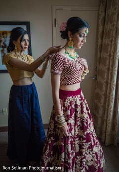 Indian bride getting her kundan choker necklace. Indian bride getting her kundan choker necklace.