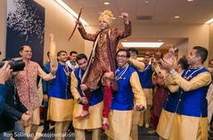 Indian groom lifted by groomsmen capture. Indian groom lifted by groomsmen capture.