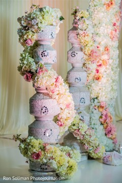 Indian wedding white pot pillars decorations with real flowers. Indian wedding white pot pillars decorations with real flowers.