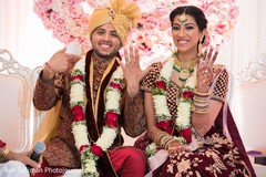 Indian couple showing their wedding rings. Indian couple showing their wedding rings.