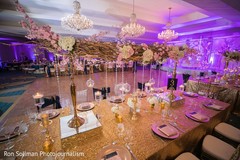 Golden, pink and white indian wedding reception table decoration. Golden, pink and white indian wedding reception table decoration.