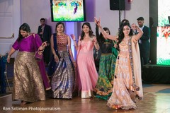 Indian bridesmaids making their entrance to wedding reception. Indian bridesmaids making their entrance to wedding reception.