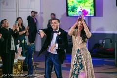 Indian couple's happy entrance to wedding reception. Indian couple's happy entrance to wedding reception.