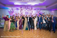Indian couple at reception stage with wedding guests capture. Indian couple at reception stage with wedding guests capture.