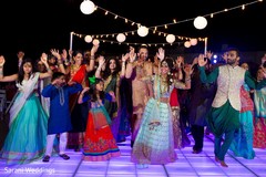 Indian bride dancing with guests at sangeet party. Indian bride dancing with guests at sangeet party.