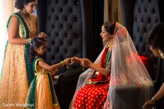 Indian bride getting her bangles from flower girl. Indian bride getting her bangles from flower girl.