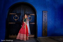 Indian bride on her red and green ceremony lehenga. Indian bride on her red and green ceremony lehenga.