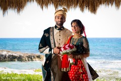Indian bride and groom on their ceremony outfits. Indian bride and groom on their ceremony outfits.