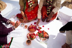 Indian relatives at the mandap during ceremony rituals. Indian relatives at the mandap during ceremony rituals.