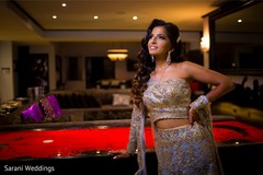 Indian bride posing with her reception golden and light purple. Indian bride posing with her reception golden and light purple.
