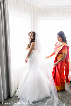 Indian relative preparing Maharani's veil for the pictures Indian relative preparing Maharani's veil for the pictures