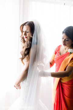Indian relative adjusting Maharani's dress Indian relative adjusting Maharani's dress