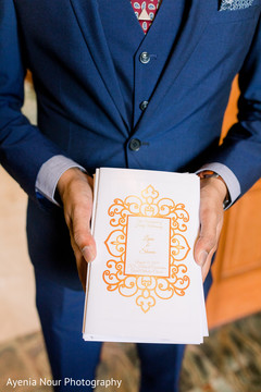 An Indian relative with the wedding programs An Indian relative with the wedding programs