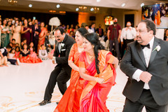Indian wedding relatives dancing at reception. Indian wedding relatives dancing at reception.