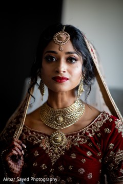 Indian bride wearing her ceremony jewelry. Indian bride wearing her ceremony jewelry.