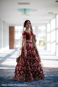 Indian bride wearing on her red lehenga. Indian bride wearing on her red lehenga.