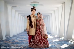 Indian couple on their golden and deep red ceremony outfits. Indian couple on their golden and deep red ceremony outfits.