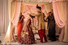 Indian groom putting garland to bride ritual. Indian groom putting garland to bride ritual.